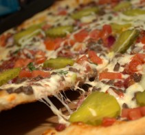 My own "puling the cheese" shot of the bacon cheeseburger pizza from Papa Murphy's